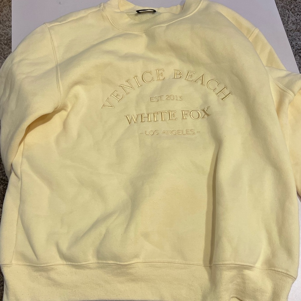 white fox yellow sweatshirt